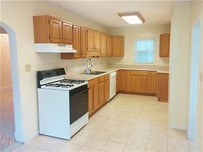 Lots of cabinet AND counter space.   Brand-new, never-used dishwasher!