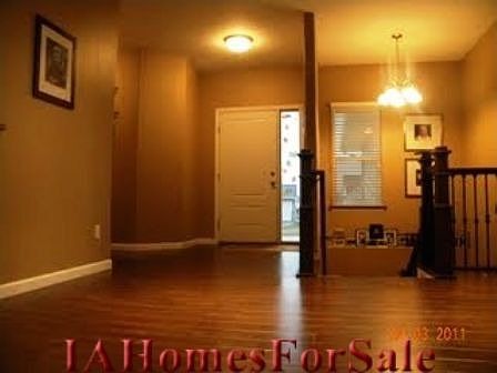 Foyer - Beautiful flooring throughout main floor living area, custom hardwood railing from Squaw Creek millwork