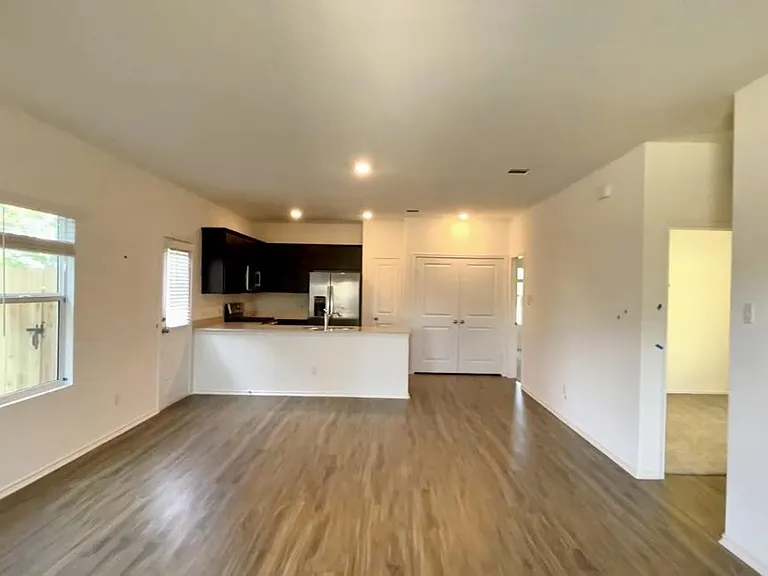 Open floorplan with dining, living, and kitchen.