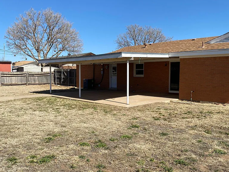 Backyard from back corner toward the house.