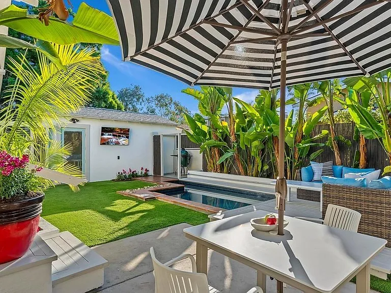 Another view of the cocktail-sized pool and backyard