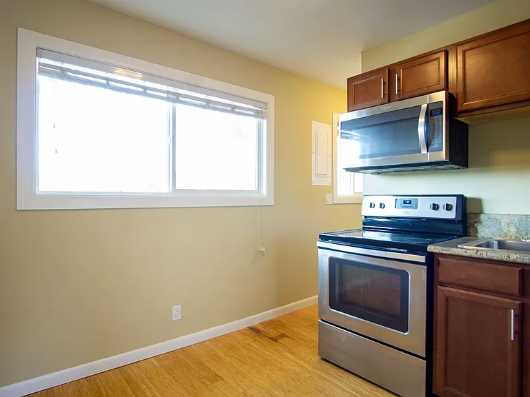 Get 1 Month FREE! Top-Floor 2-Bedroom with Bamboo Flooring + Off-Street Parking! — Photo 6