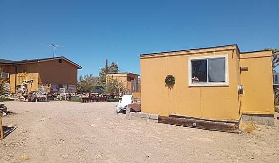 Shop on right, water tank in