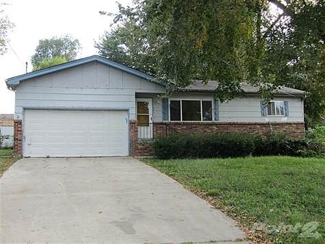 Brick and frame exterior home with a 2 car garage
