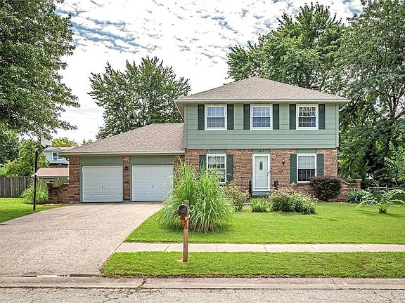 This home features a 2 car garage with a long driveway for extra parking!