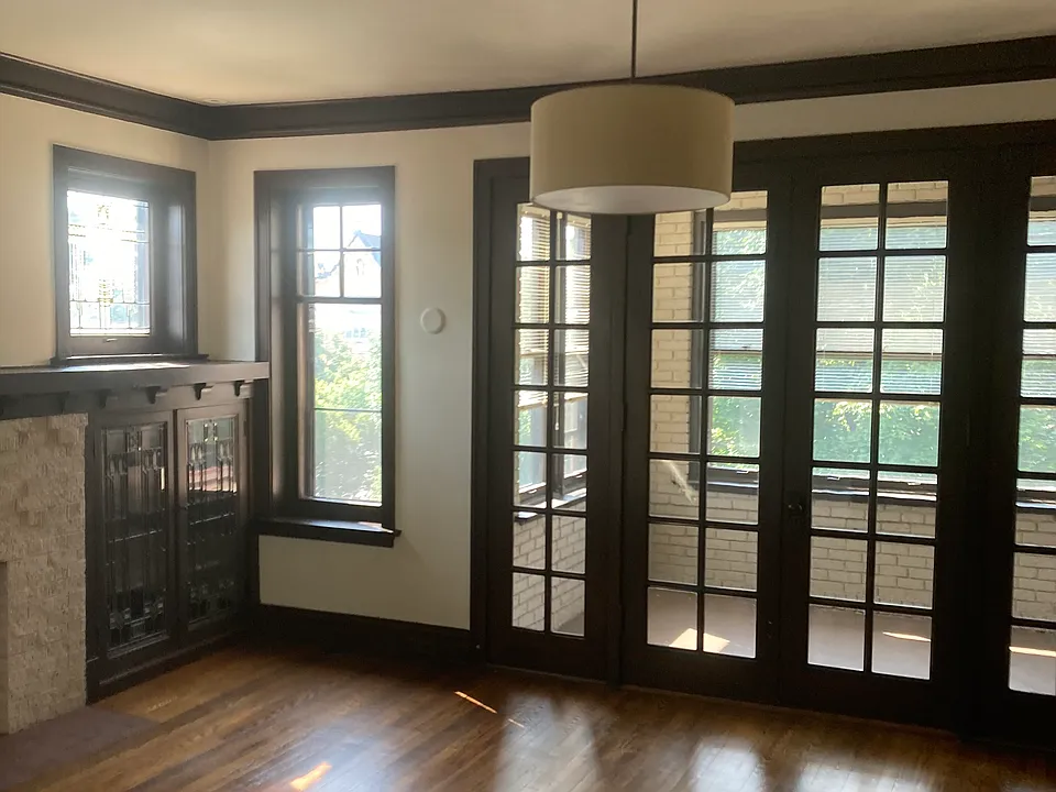 Living room with French doors leading to solarium