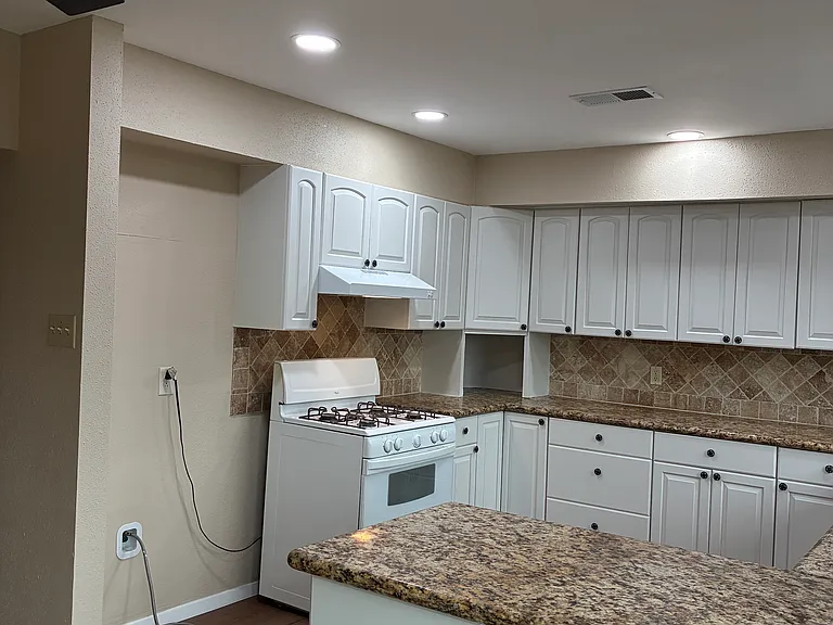 Kitchen - lots of cabinets and new floor