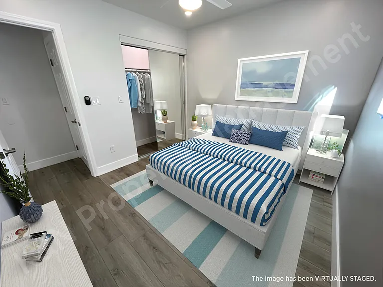 Bedroom #2 with large mirrored closet.