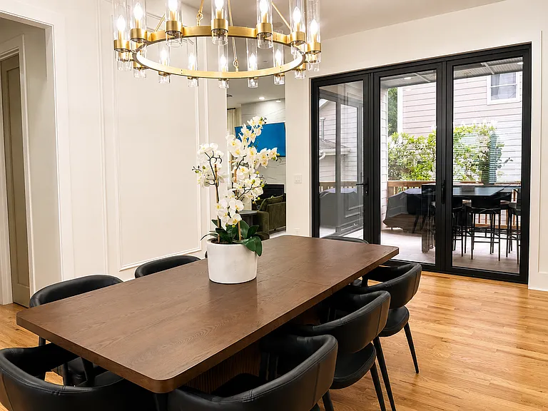 Elegant dining space with seating for 8, steps away from your chef's kitchen and curated designer espresso bar! Designed for peaceful breakfasts, celebratory dinners, game nights, and meaningful moments together in a warm, elevated setting.