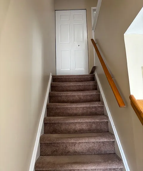 Stairwell leading up to closet on second floor