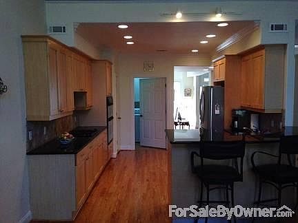 Modern kitchen with stainless appliances
						:
						Granite counters; maple cabinets; ; built-in dishwasher & microwave
