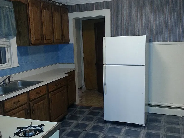 Kitchen towards bathroom entrance