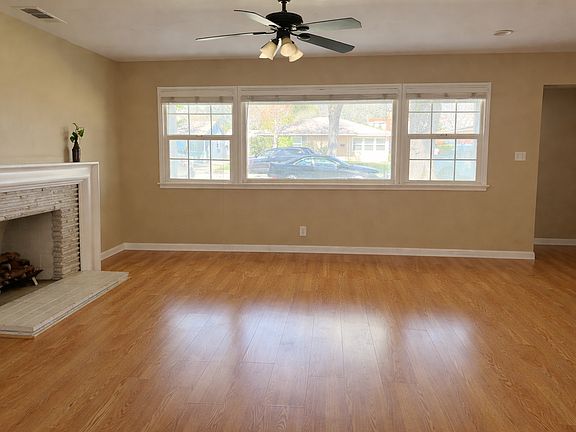 Living room with working gas fireplace.