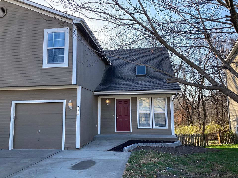 Front View with single garage & double wide drive.