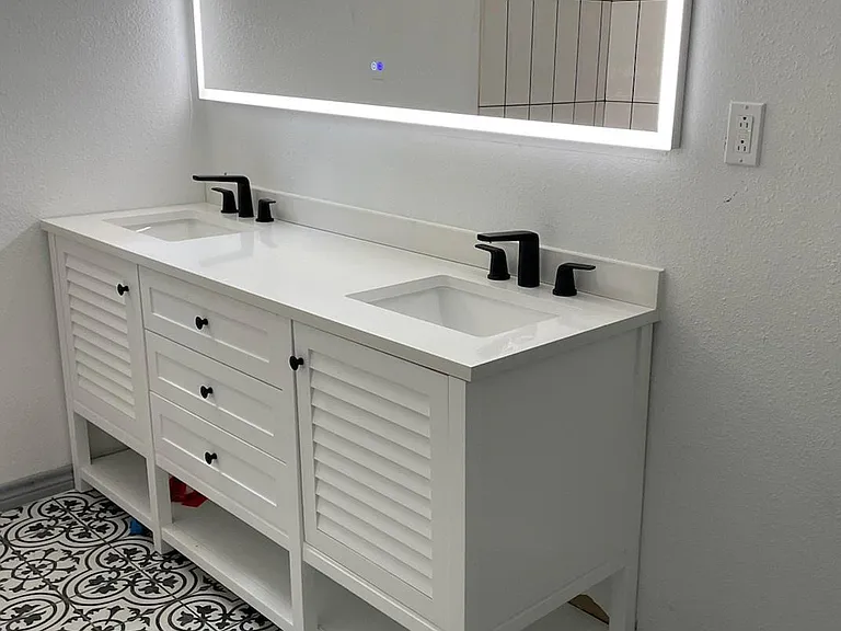 Double vanity with LED mirror in master bathroom