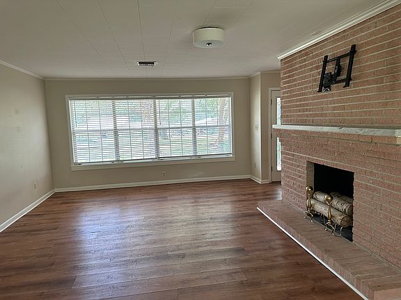 Family room with decorative fireplace.