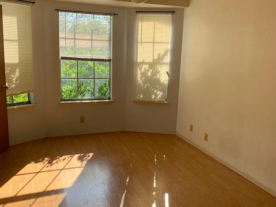 Bedroom one with bay windows, private full bath and walk ini closet.