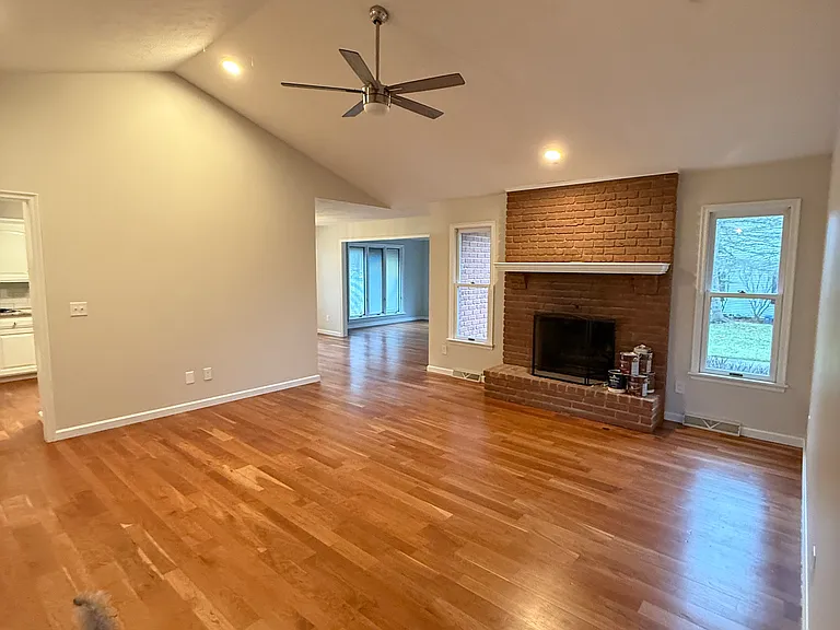 Family room with fireplace and high ceiling