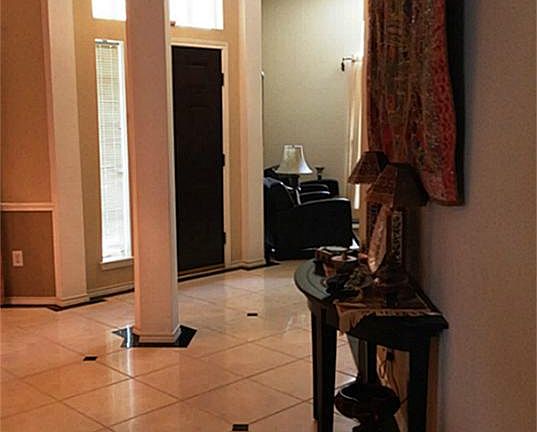 Gorgeous Travertine and marble floors throughout the foyer and both formals