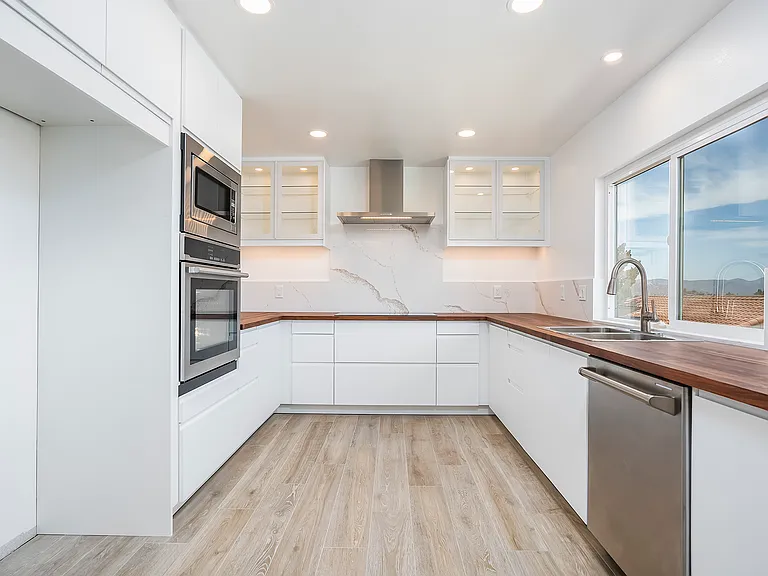 All new appliances and fully extending drawers, and soft-close cabinets and doors throughout.