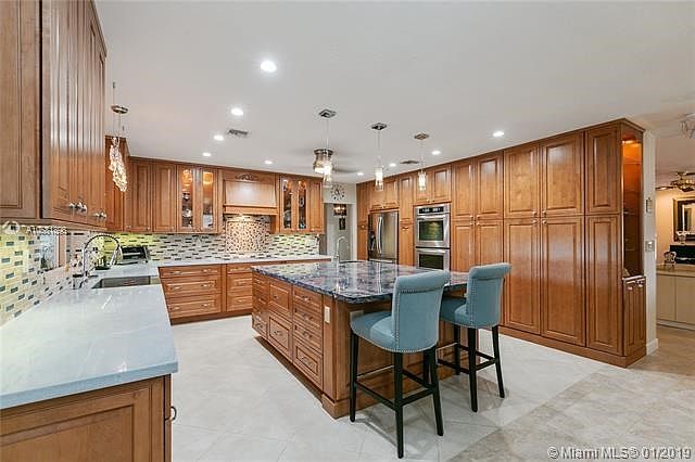 Enjoy entertaining out of the sun in this covered, screened in patio area. Sit and enjoy your morning coffee or evening wine, ch