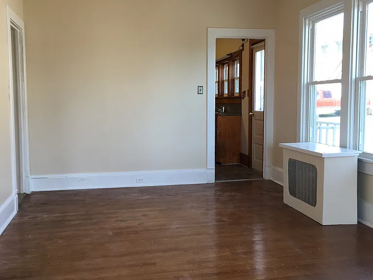 Dining Room. Kitchen doorway on the right. Hallway door on the left.