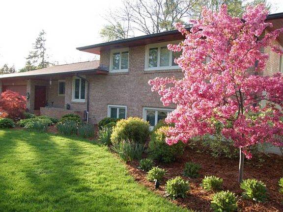 This beautifully landscaped yard is a fitting introduction to a superb interior.