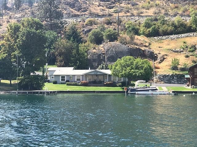 Spacious, one level, waterfront home
near water's edge in quiet cove.