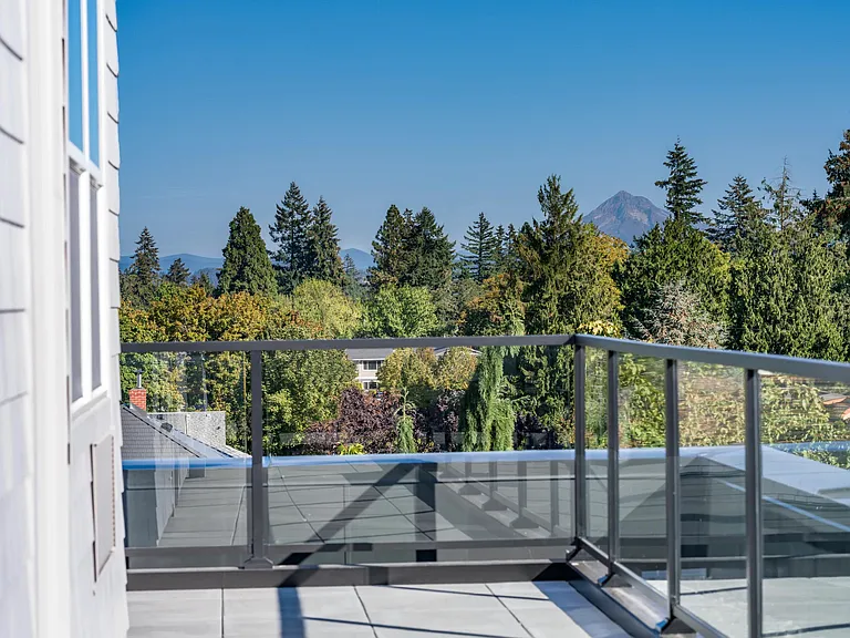 Enjoy fresh air and scenic views from private balconies and patios, available in select homes at Modera Woodstock.