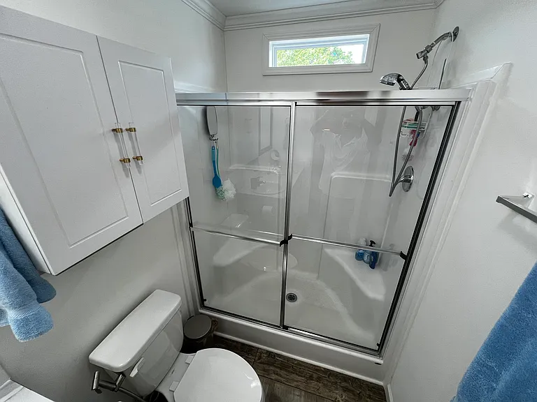Master Bathroom - Shower with double seating areas and transom window.