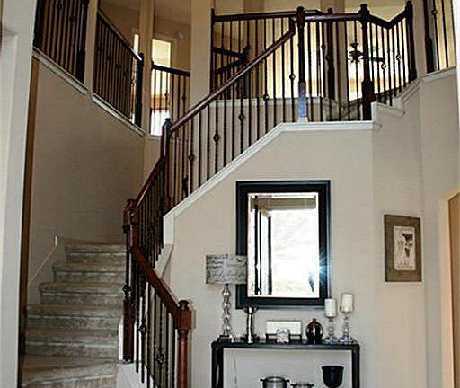  As seen from the front door, this stacked stair case offers a view of what's to come!