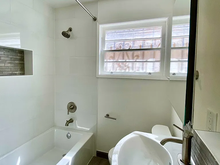 Fully renovated bathroom with modern finishes.