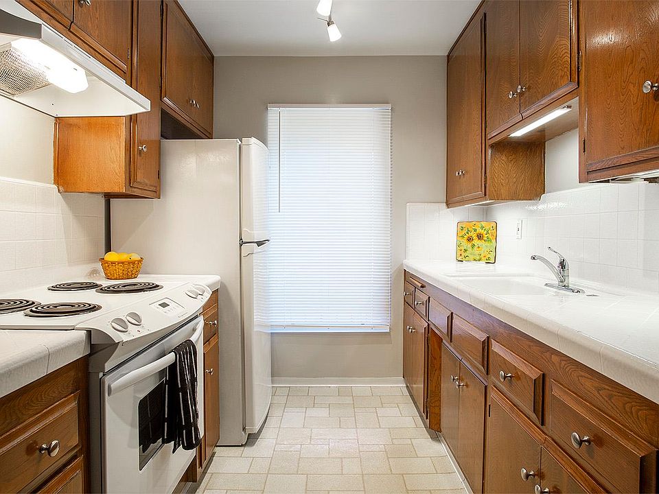 Kitchen with appliances and under counter lighting