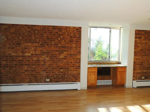 Living area, with granite-topped desk