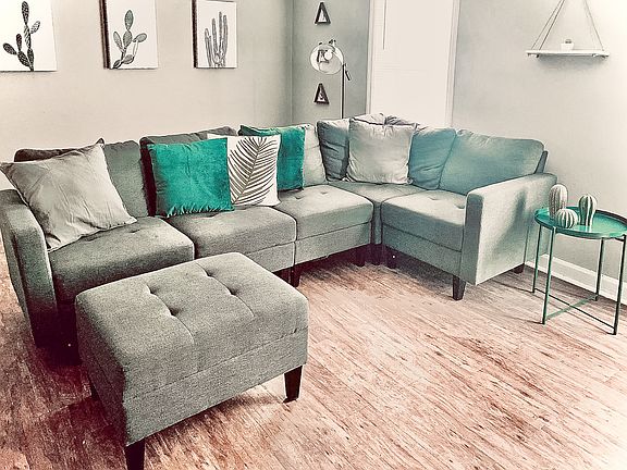 Gorgeous open living room with sectional couch.