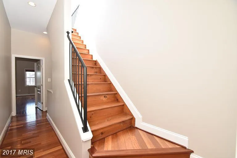Convenient stairs leading to the roof deck!