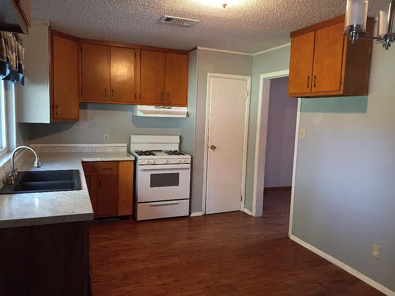 Kitchen gas oven and cabinet storage