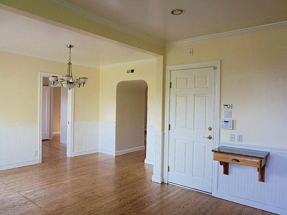 Kitchen and dining area, door leads to garage.