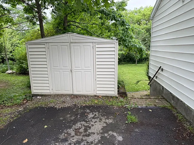 Shed for storage. 
There is also a trash & recycling shed