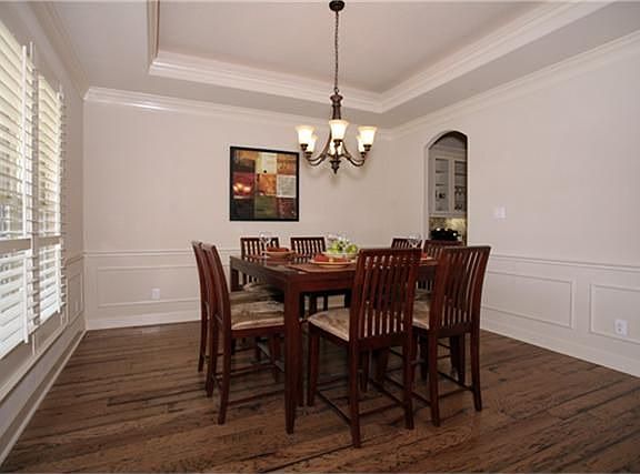 Another view of formal dining room. Note the plantation shutters on front windows.