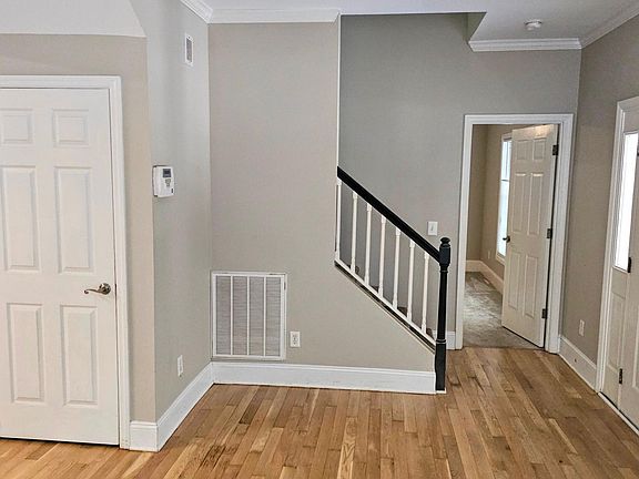 Living Rm looking to Primary BR with Kitch/Dining to left. - Floors newly redone in light natural color