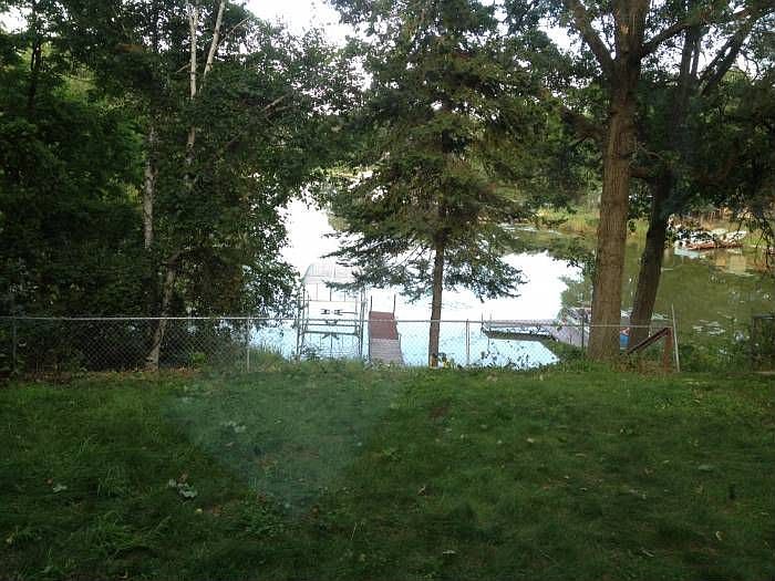 lake front, fenced yard