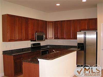 Upscale kitchen, granite counters, cherry wood cabinets, sta