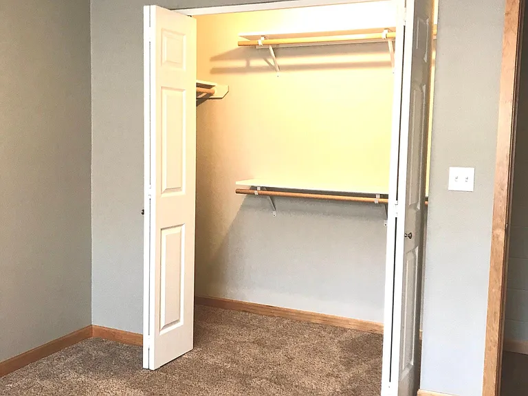 Deep, well organized closet, with it's own light so you can see your clothes in the morning!