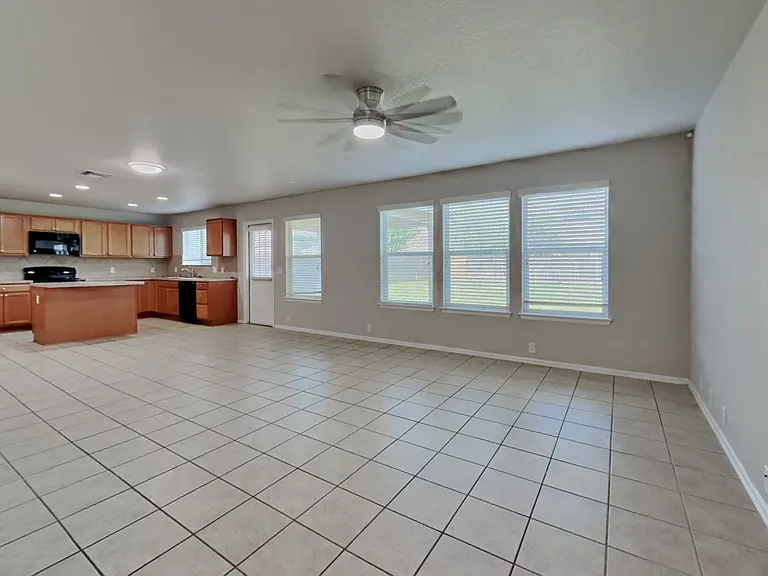 Spacious kitchen with light wo