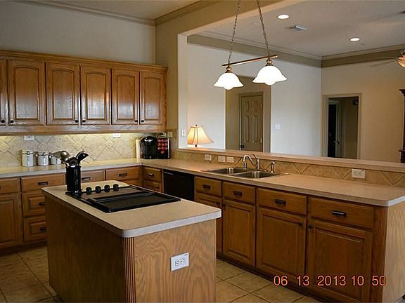 Alternative view of kitchen as it opens into the living area.