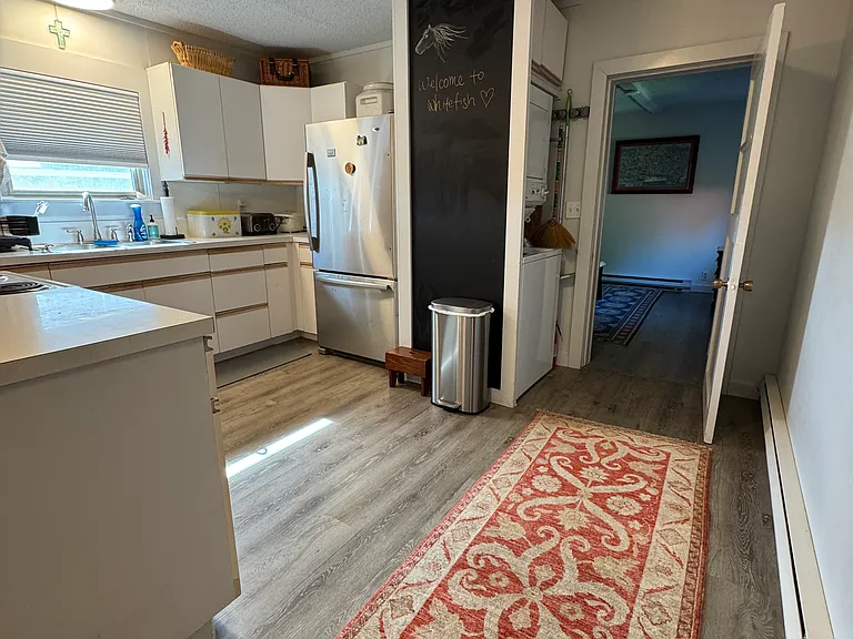 Kitchen , Stack washer/ Dryer and Entry to master bedroom