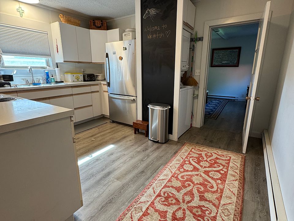 Kitchen , Stack washer/ Dryer and Entry to master bedroom