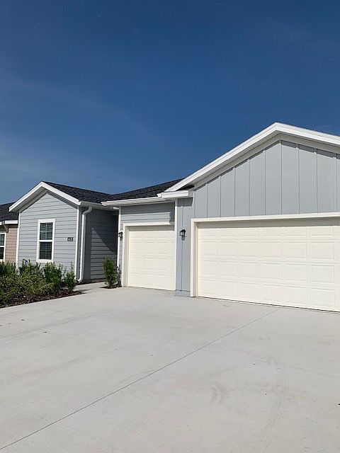 FRONT OF HOUSE THREE CAR GARAGE