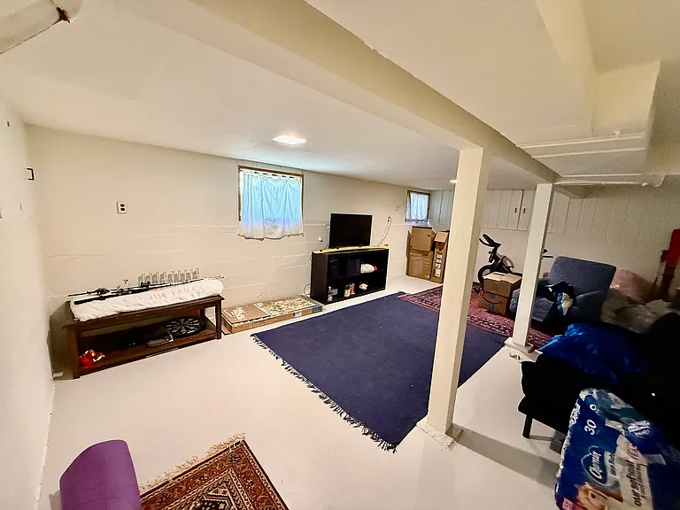 semi-finished basement, with 2 windows that open with screens